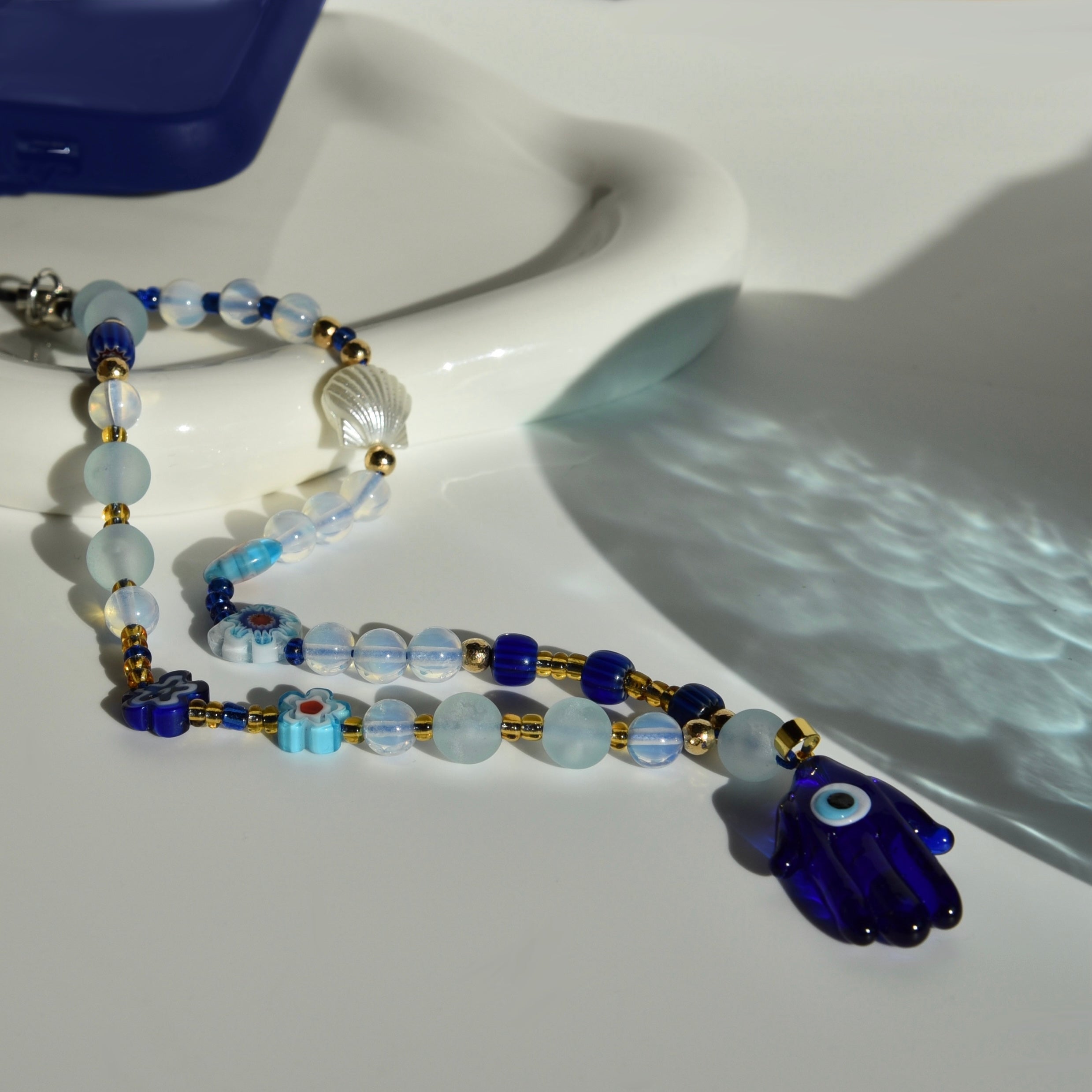 CHARM TELEFONO BLUE RAY